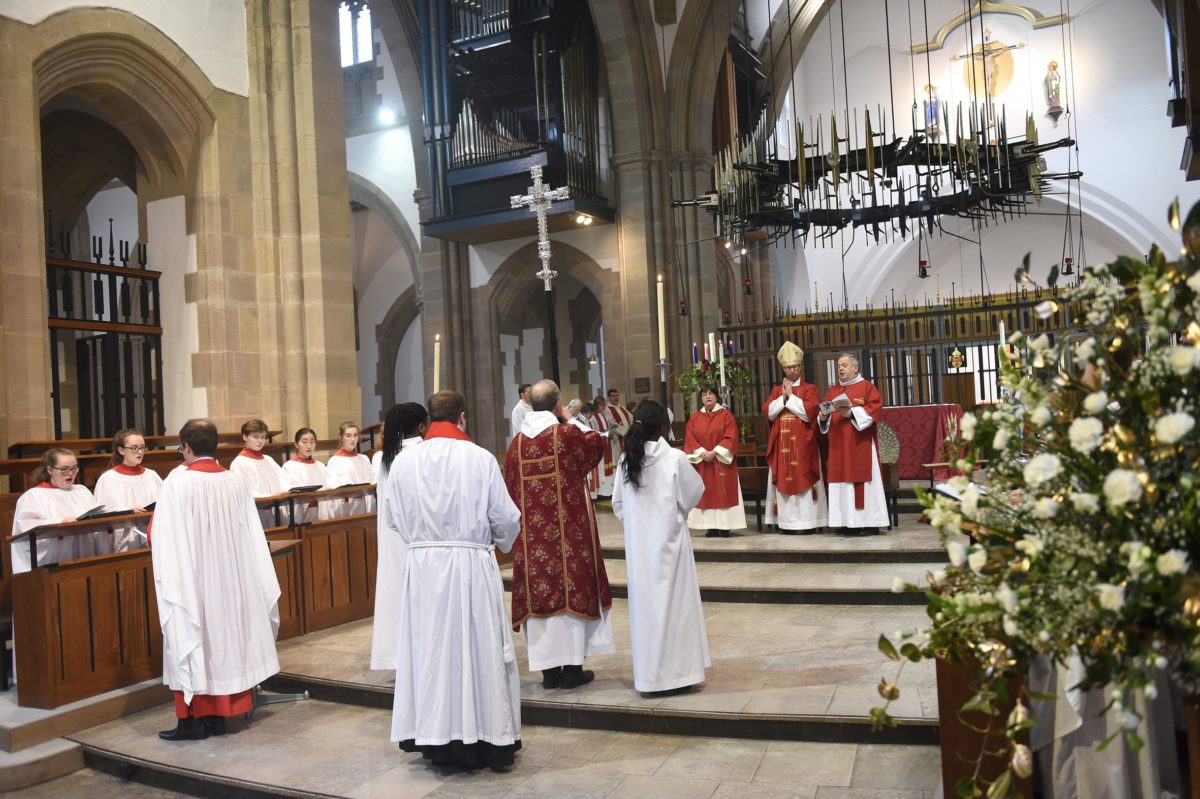 Prayer Festival service being held at Blackburn Cathedral, with members walking towards the front of the Cathedral